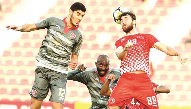 Al Duhailu2019s Karim Boudiaf (left) and Diego Jardel of Al Arabi vie for the ball during the QNB Stars League match yesterday.