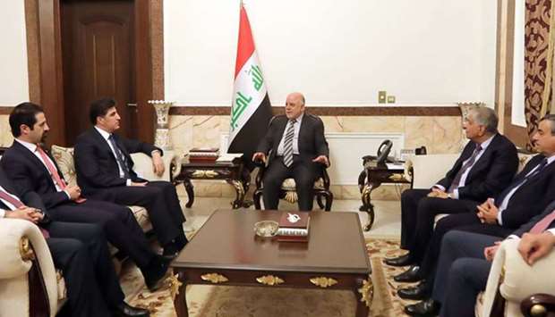 Iraqi Prime Minister Haider al-Abadi (C) meeting with Nechirvan Barzani (2nd from L), prime minister of Iraq's Kurdistan Regional Government (KRG), at his Baghdad office.  AFP / HO /IRAQI PRIME MINISTER'S OFFICE