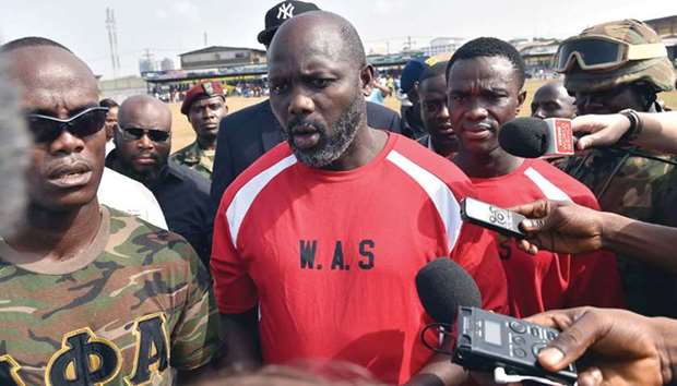 George Weah speaks to the press prior to taking part in a football match between Weah all stars team and army football team in Monrovia yesterday.
