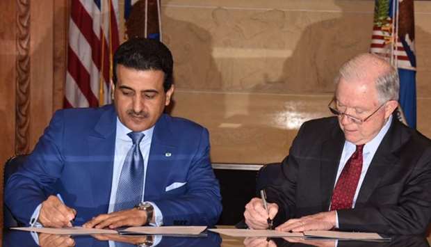 Qatar's Attorney General HE Dr Ali bin Fetais al-Marri and US Attorney General Jeff Sessions sign an MoU at Washington