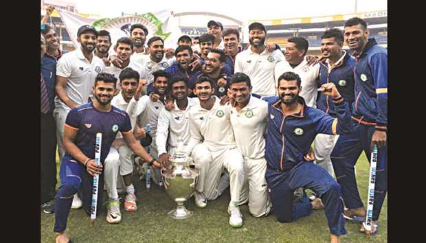 Vidarbha players celebrate with Ranji Trophy after defeating Delhi in the final yesterday. (BCCI)