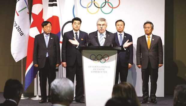 International Olympic Committee (IOC) President Thomas Bach (centre) speaks to the press after a meeting with the National Olympic Committees (NOC) of North Korea and South Korea, and a delegation from the Pyeongchang 2018 Organising Committee (POCOG) at the Olympic Museum in Lausanne, Switzerland, yesterday. (Reuters)
