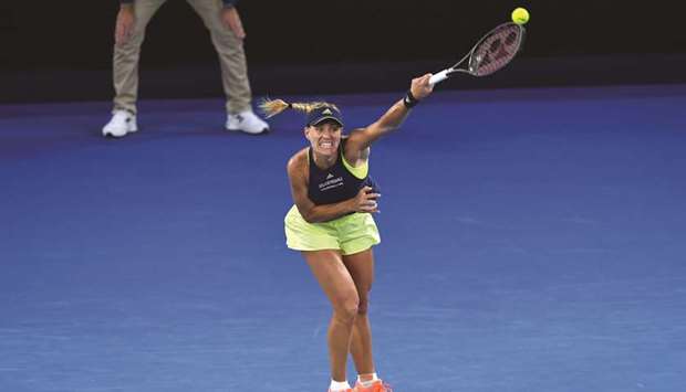Germanyu2019s Angelique Kerber hits a return during their womenu2019s singles third round match against Russiau2019s Maria Sharapova in Melbourne yesterday.