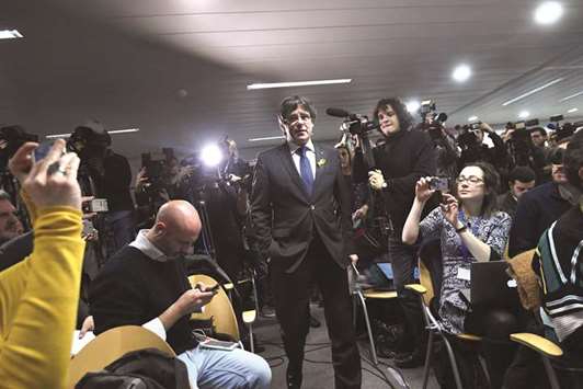 This file photo taken on December 22, 2017 shows Puigdemont arriving for a press conference in Brussels, a day after the Cataloniau2019s regional election.