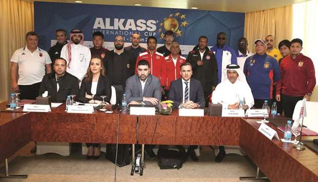Officials and coaches pose after the technical meeting ahead of the seventh Al Kass International Cup.