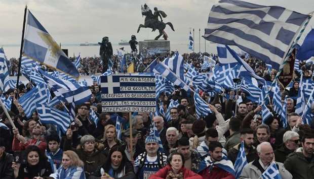 People holding flags of Greece take part in a demonstration to protest against the use of the name Macedonia following the developments on the issue with the neighbour country, in Thessaloniki