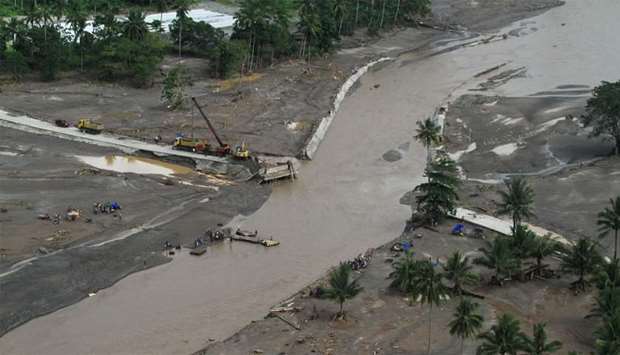 An aerial image shows damaged Daligdigan Bridge, washout and drifted some 600 meters from its original position, at the height of Tropical Storm Vinta that hit Salvador town