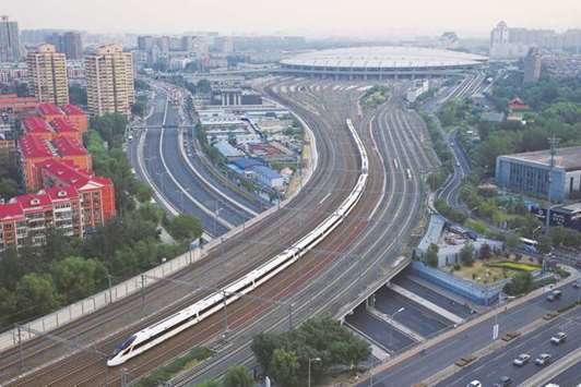 A bullet train departs from Beijing South Railway Station to Shanghai (file). China has accumulated a mountain of debt to fuel growth since the global financial crisis, fostering zombie companies and excess industrial capacity, and prompting the International Monetary Fund to warn of the risk of a u201csharp adjustment.u201d