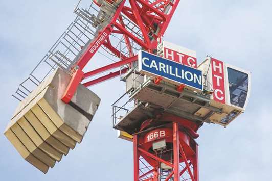 A sign hangs from a crane working on the Arundel Great Court development, operated by Carillion, in London. Carillionu2019s failure has prompted a debate in Britain about both how companies are run and the extent to which the government relies on businesses to provide services.