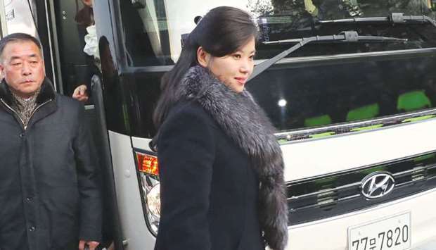Hyon Song-wol (centre), leader of North Koreau2019s popular Moranbong band, arrives at the Gangneung Arts Center where one of the planned musical concerts is due to be held, in the eastern city of Gangneung.
