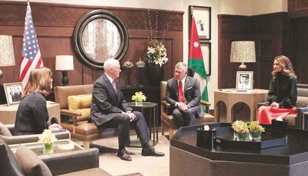 A handout picture released by the Jordanian Royal Palace yesterday shows Jordanian King Abdullah II and Queen Rania of Jordan meeting with US Vice President Mike Pence in the capital Amman.