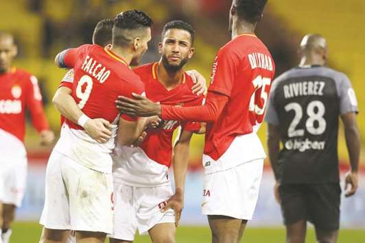Monacou2019s Jorge (centre) celebrates with teammates after scoring a goal against Metz during their Ligue 1 match in Monaco yesterday. (AFP)