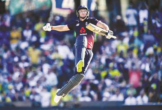 Englandu2019s Jos Buttler celebrates after reaching his century against Australia at the Sydney Cricket Ground yesterday.