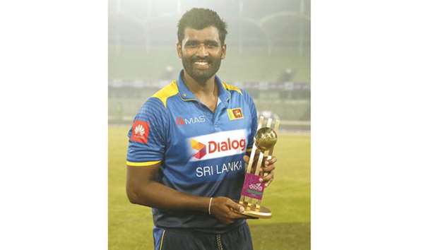 Sri Lankan all-rounder Thisara Perera with his man-of-the match trophy.