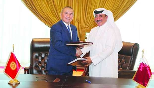 HE Jassim Saif Ahmed al-Sulaiti and Jamshitbek Kalilov sign the air services agreement between Qatar and the Kyrgyz Republic (Kyrgyzstan) in Doha on Sunday.