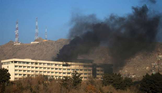 Smoke rises from the Intercontinental Hotel during an attack in Kabul, Afghanistan