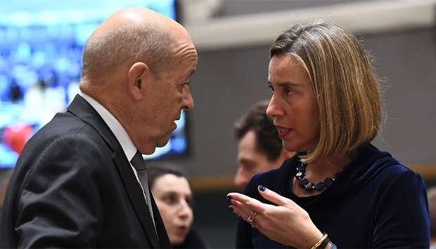 France's Foreign Minister Jean-Yves Le Drian (L) and EU foreign policy chief Federica Mogherini spea