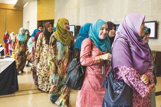 Delegates wait in line for a seminar at the Global Islamic Finance Forum in Kuala Lumpur (file). Malaysia on the ground of a solidly expanding economy remains on top of the Islamic finance industry.