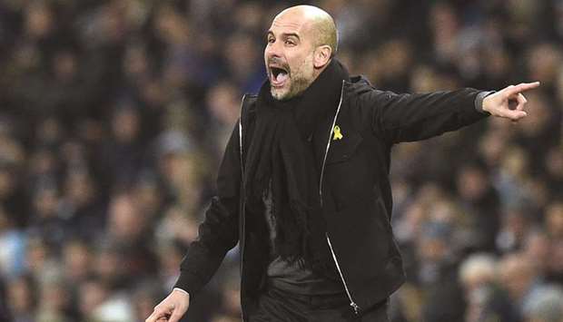 Manchester Cityu2019s manager Pep Guardiola gestures on the touchline during the English Premier League match against Newcastle United at the Etihad Stadium in Manchester on January 20, 2018. (AFP)