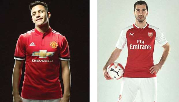 Alexis Sanchez poses in a Manchester United shirt and Henrikh Mkhitaryan in Arsenal shirt yesterday.