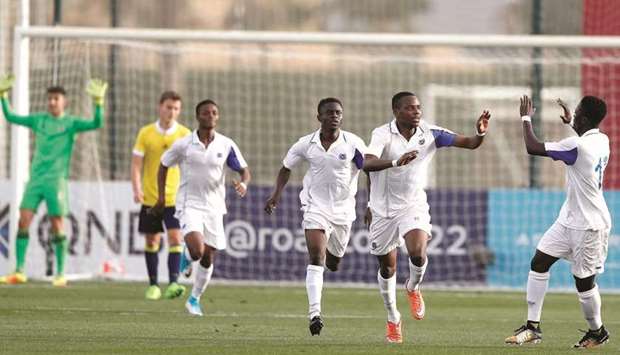 Aspire Football Dreams players celebrate after scoring against Fenerbahce at the U-17 Al Kass Cup football tournament.
