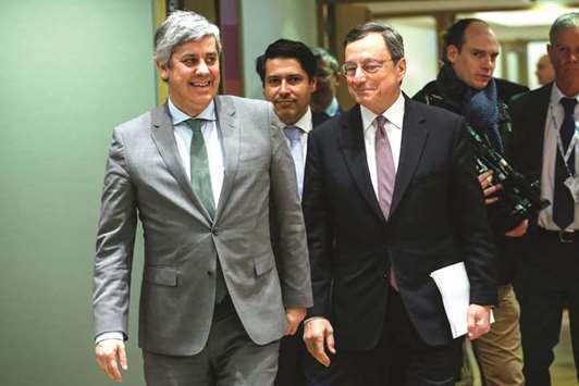 Mario Centeno, Portugalu2019s finance minister and head of the group of euro-area finance ministers (left), walks with ECB president Mario Draghi, as they arrive for a Eurogroup meeting of EU finance ministers in Brussels on Monday. The groupu2019s concern is whether the euro area will be ready to cope with the departure of Draghi, who has pushed through much of the stimulus that averted deflation, cut unemployment and revived some of the u201canimal spiritsu201d the region lacked. Draghi will retire in October 2019.
