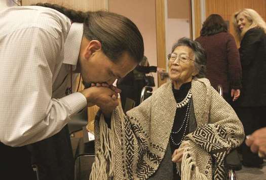 REVERED: Upper Skagit tribal elder Vi Hilbert is greeted by Freddie Lane, Lummi, as she arrives for a preview of Su2019abadeb, at Seattle Art Museum in October 2008. She helped revive the Lushootseed language.
