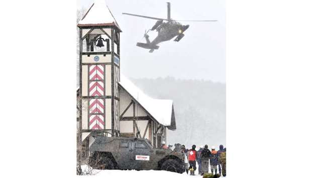 Japanu2019s Self-Defence Forceu2019s helicopter takes part in rescue work at a ski resort nearby Kusatsu-Shirane volcano in Gunma Prefecture, northwest of Tokyo, yesterday.