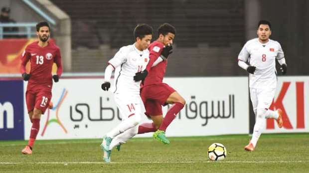 Action from the AFC U23 Championship match between Qatar (in maroon) and Vietnam (in white) yesterday. (AFC)