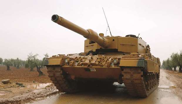A Turkish military tank is seen near Mount Barsaya, northeast of Afrin, Syria.
