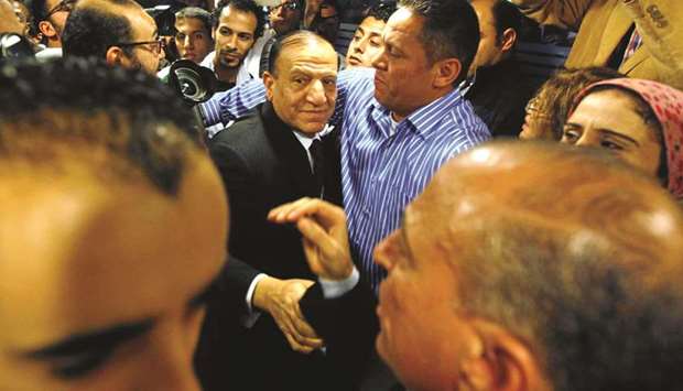 File photo shows Egyptu2019s former army chief of staff Sami Anan, leaving a news conference at his office in Cairo.