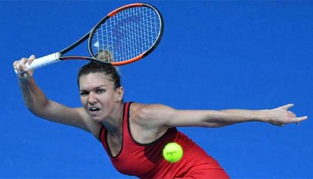 Romania's Simona Halep hits a return against Germany's Angelique Kerber at the Australian Open in Melbourne on Thursday.
