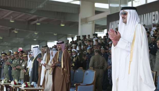 His Highness the Emir Sheikh Tamim bin Hamad al-Thani, accompanied by other dignitaries, attending the graduation ceremony of the 13th class of officer cadets of Ahmed bin Mohamed Military College.