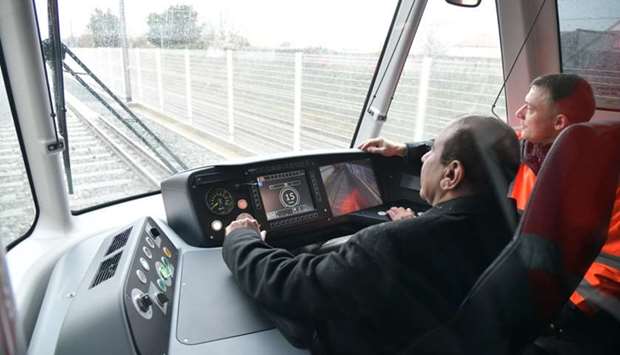 HE the Minister of Transport and Communications Jassim Seif Ahmed al-Sulaiti during the testing of the tram-train.Qatar Rail: First Lusail train rolls out of French factory