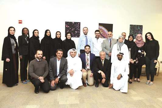 WCM-Q alumni with faculty and staff.