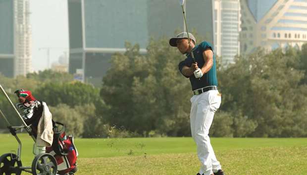 Ayoub Id-Omar plays a tee shot at the Doha Golf Club.