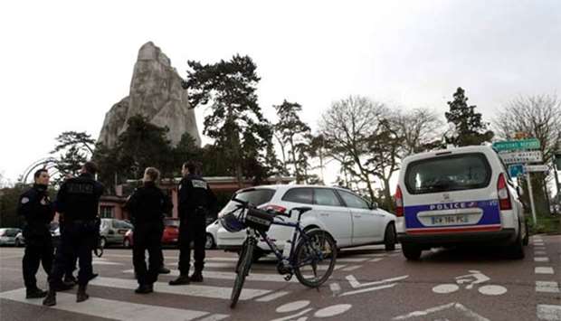Police officers patrol outside of the Paris Zoological Park in the Bois de Vincennes, eastern Paris, on Friday following the escape of baboons from their enclosure.
