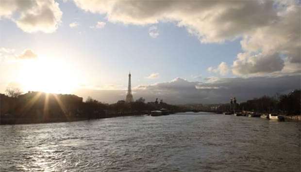 The flooded banks of the river Seine with the Eiffel Tower seen in the backround in Paris.