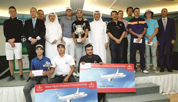 Pakistanu2019s Ahmed Baig (centre) poses with the trophy and other winners of the Qatar Open Amateur Golf Championship at the Doha Golf Club yesterday. PICTURES: Jayaram