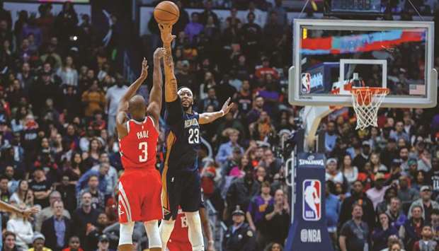 New Orleans Pelicans forward Anthony Davis (right) defends as Houston Rockets guard Chris Paul attempts to shoot during the fourth quarter of NBA game at the Smoothie King Center in New Orleans on Friday. (USA TODAY Sports)