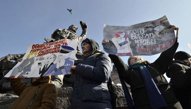 Supporters of Russian opposition leader Alexei Navalny attend a rally for a boycott of a March 18 presidential election in the far eastern city of Vladivostok, Russia.