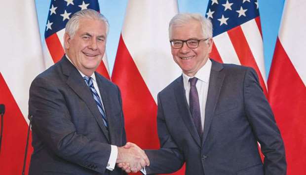 US Secretary of State Rex Tillerson (left) and Polish Foreign Minister Jacek Czaputowicz shake hands during a joint press conference after their meeting in Warsaw on Saturday. Europe should seek to diversify energy supplies, Tillerson said.