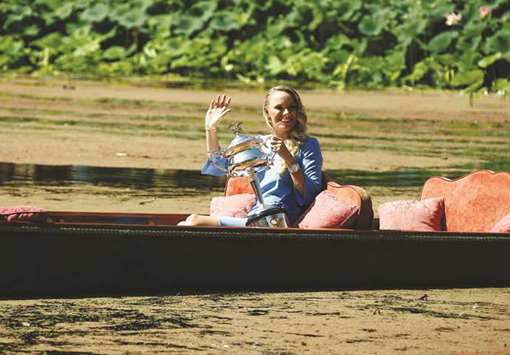 Caroline Wozniacki of Denmark poses with the womenu2019s singles trophy in a gondola during the winneru2019s photoshoot at the Botanical Gardens in Melbourne, Australia, yesterday. (Reuters)