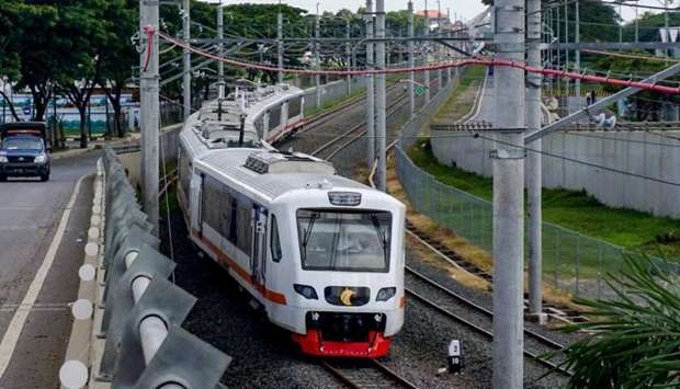 A train is seen along the newly built airport train line linking Soekarno-Hatta International Airport in Tangerang, on the outskirts of Jakarta