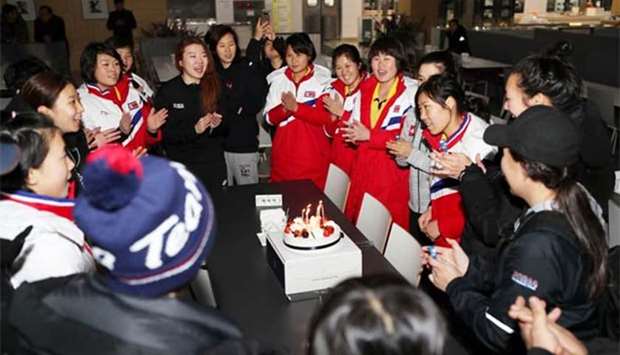 A North Korean women's ice hockey athlete is congratulated on her birthday in Jincheon National Training Centre in Jincheon, South Korea, on Sunday.