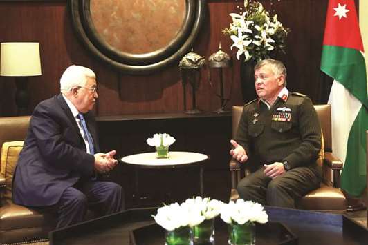 Jordanu2019s King Abdullah meets with Palestinian President Mahmoud Abbas at the Royal Palace in Amman, yesterday.