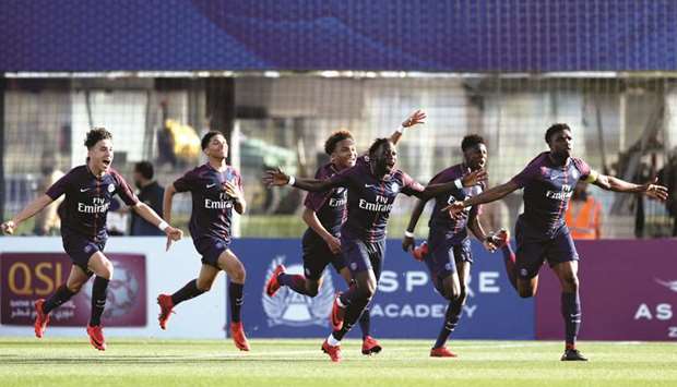 Paris Saint-Germain players celebrate after winning their semi-final match against Esperance de Tunis at the Al Kass Cup under-17 football tournament yesterday. PICTURE: Jayaram
