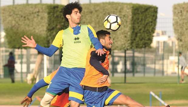 Al Gharafa players in action during a training session yesterday.