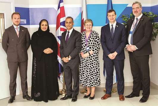 Ajay Sharma and Sheikha Dr Aisha bint Faleh al-Thani with other dignitaries.