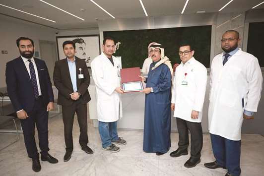 Certificate awarded to Al Emadi Hospital received by Dr Mohamed Abdulla al-Emadi.